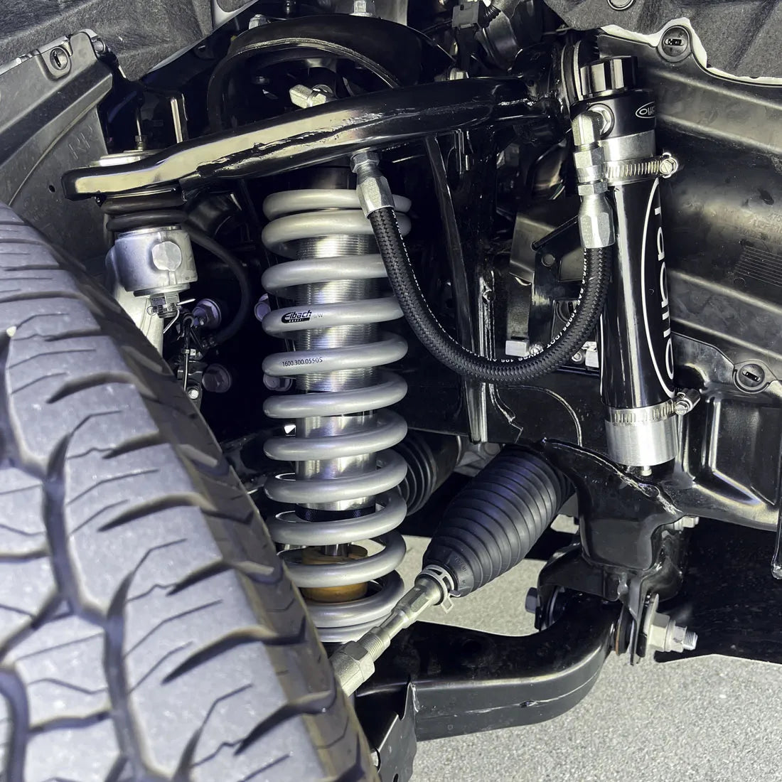 RADFLO SUSPENSION TECHNOLOGY | Tacoma 4th Gen (2024 - Present) Front Coilover Kit With Remote Reservoir And Compression Adjuster 2″ Lift (6CT-015-0A)