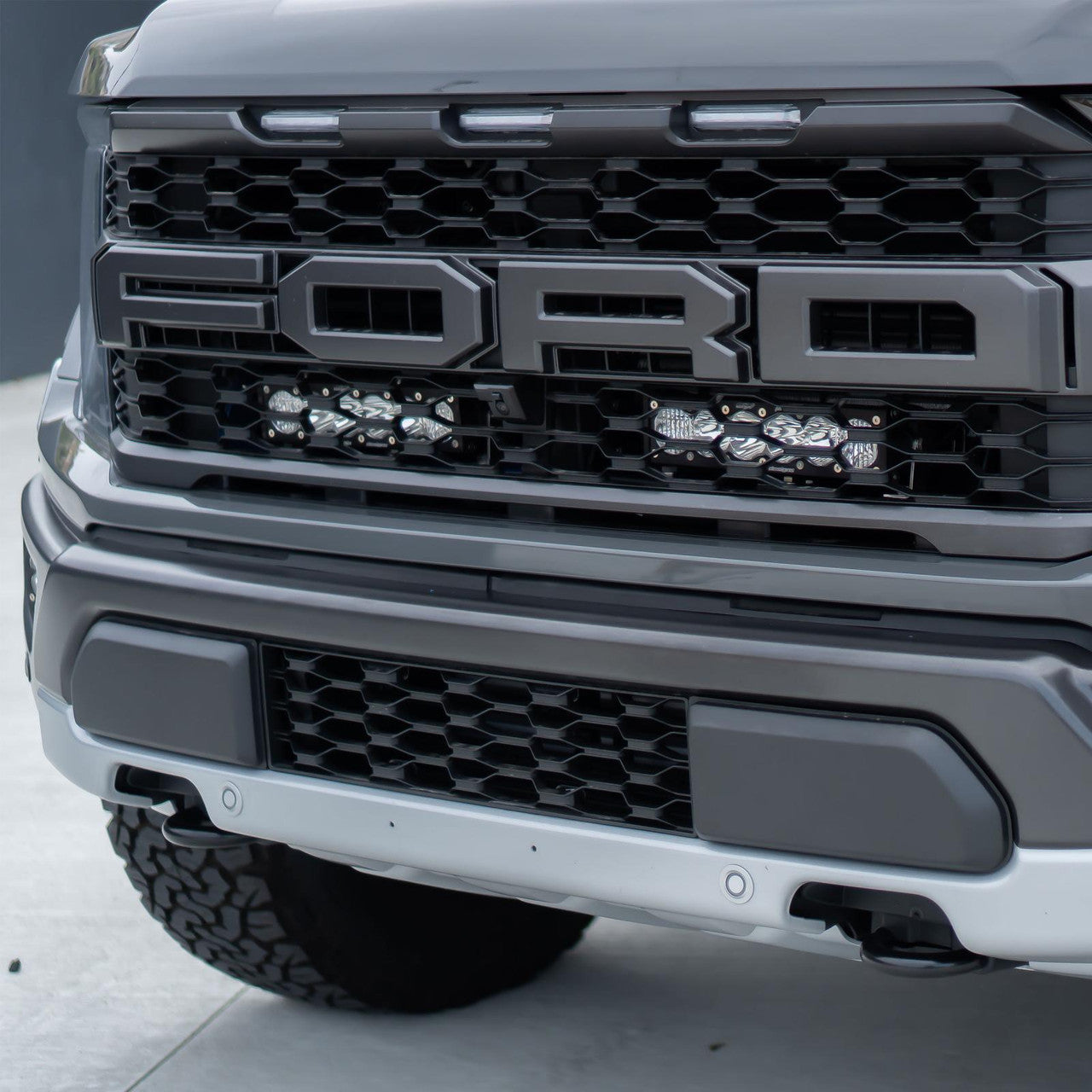 BAJA DESIGNS | Ford F-150 Raptor 2021-2024 OnX6+ 10 Inch Dual Behind Grille Light Bar Kit