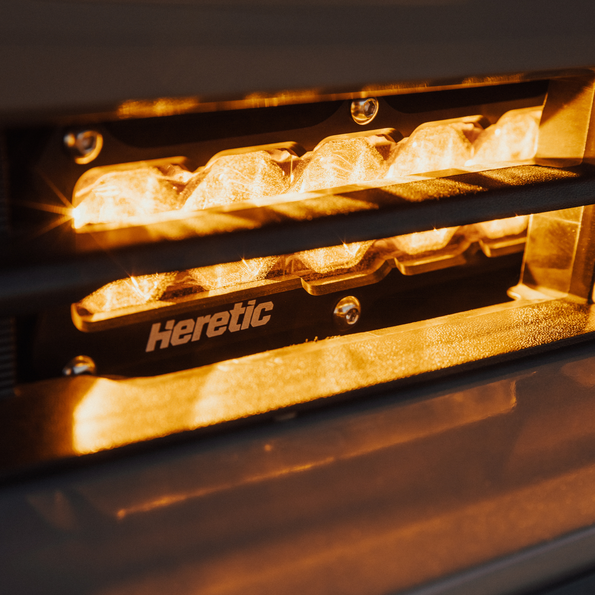 Close up of amber behind the grille light bar mounted on a toyota tacoma